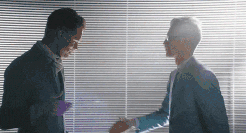 Two business people shaking hands, representing a partnership with a Google Ads agency