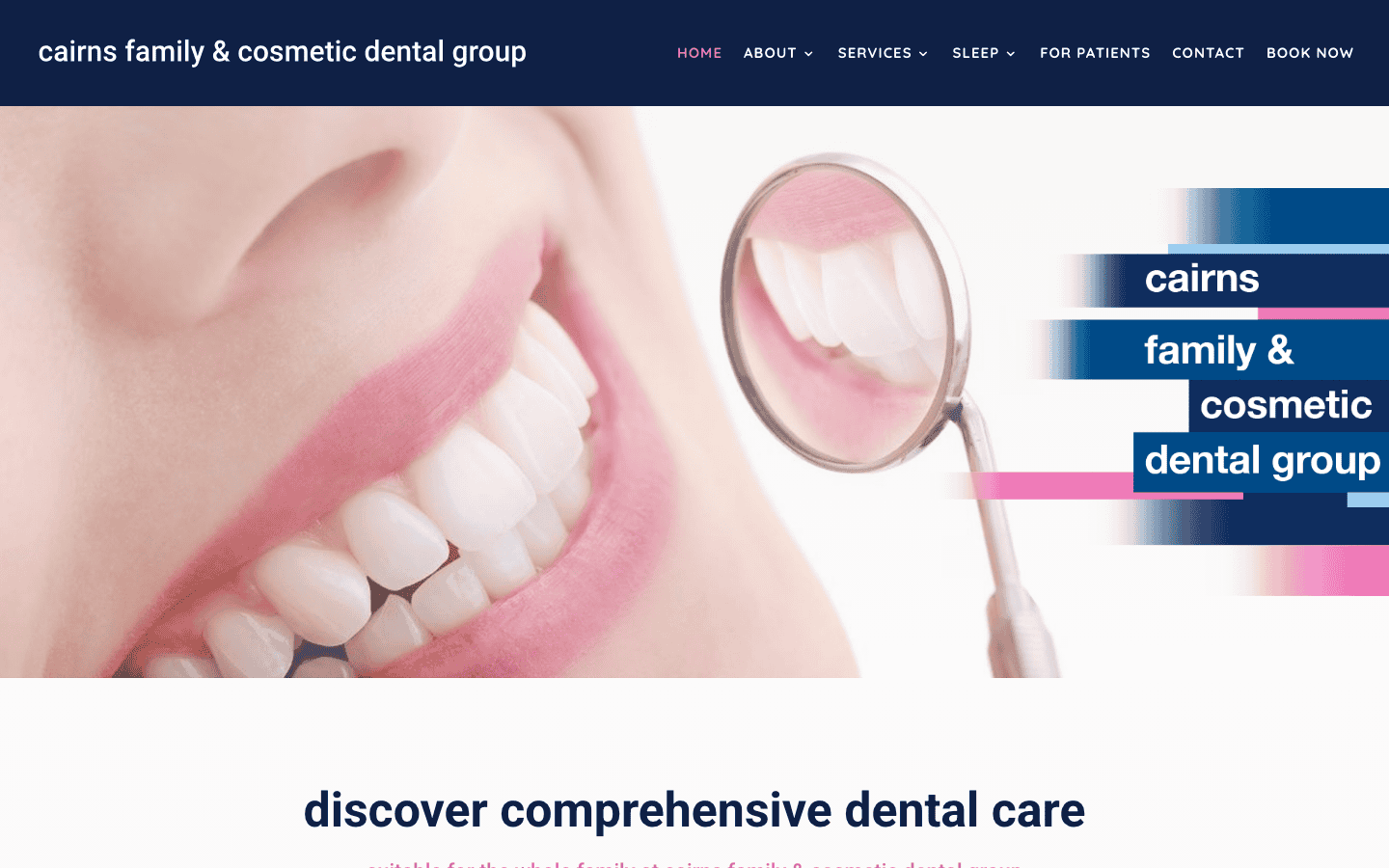 Close-up of a smiling person holding a dental mirror, showcasing healthy teeth, representing comprehensive dental care services at Cairns Family & Cosmetic Dental Group.