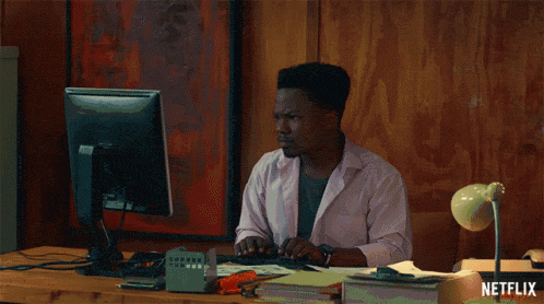 A person working at a computer desk on web design services