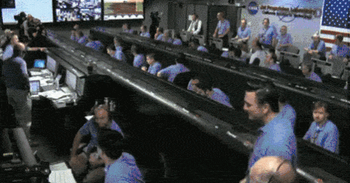 Animated GIF of NASA mission control celebrating a launch